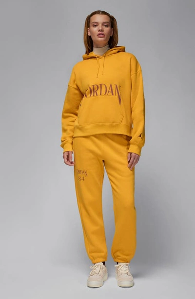 Shop Jordan Brooklyn Fleece Sweatpants In Yellow Ochre/ Dusty Peach