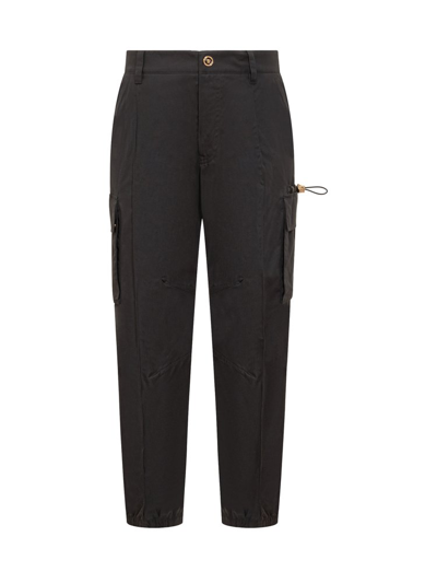 Shop Versace Elasticated Waistband Drawstring Pocket Detailed Trousers In Black