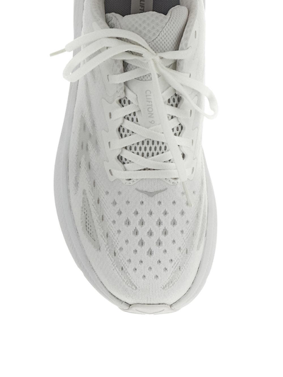 Shop Hoka Clifton 9 Sneakers In White