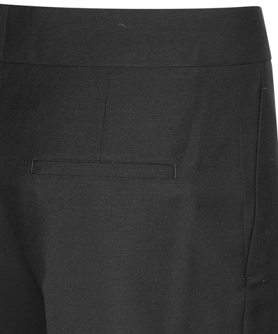Shop Givenchy Wool Blend Trousers In Black