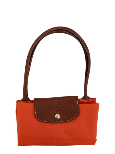 Shop Longchamp Le Pliage Medium Tote Bag In Orange