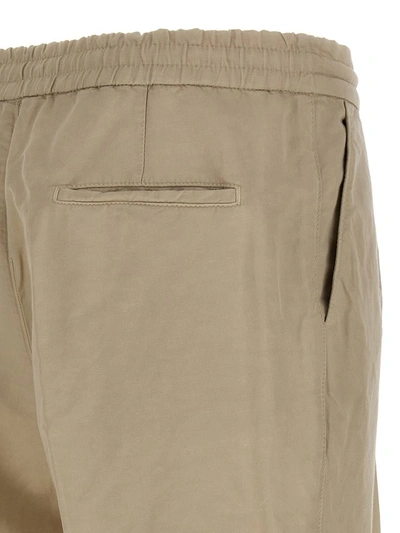 Shop Brunello Cucinelli Linen Blend Trousers In Beige