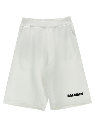 Shop Balmain Logo Print Bermuda Shorts In White/black