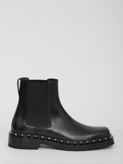 Shop Valentino Rockstud M-way Boots In Black