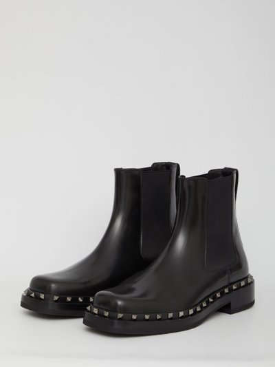 Shop Valentino Rockstud M-way Boots In Black