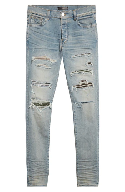 Shop Amiri Thrasher Ripped Camo Patches Skinny Jeans In Antique Indigo