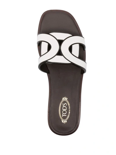 Shop Tod's Leather Flat Sandals In White