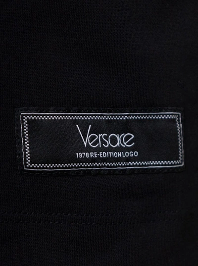 Shop Versace Black Crewneck T-shirt With Contrasting Logo Lettering Print In Cotton Man