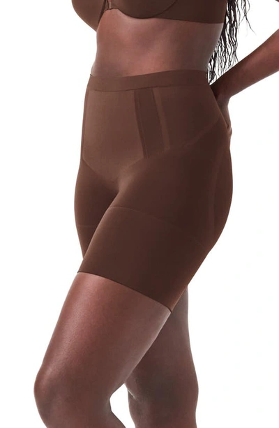 Shop Spanx Oncore Mid Thigh Shorts In Chestnut Brown