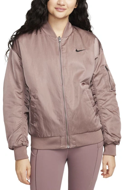 Shop Nike Sportswear Reversible Varsity Quilted Bomber Jacket In Smokey Mauve/ Violet/ Black