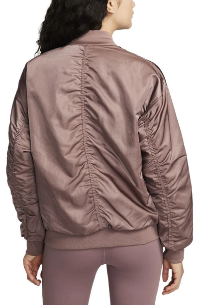 Shop Nike Sportswear Reversible Varsity Quilted Bomber Jacket In Smokey Mauve/ Violet/ Black