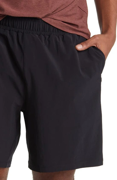 Shop Beyond Yoga Pivotal Lined Stretch Shorts In Black