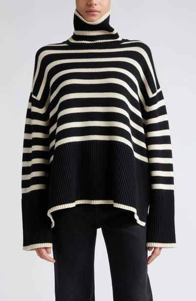 Shop Totême Toteme Stripe Wool Blend Turtleneck Sweater In Black Stripe