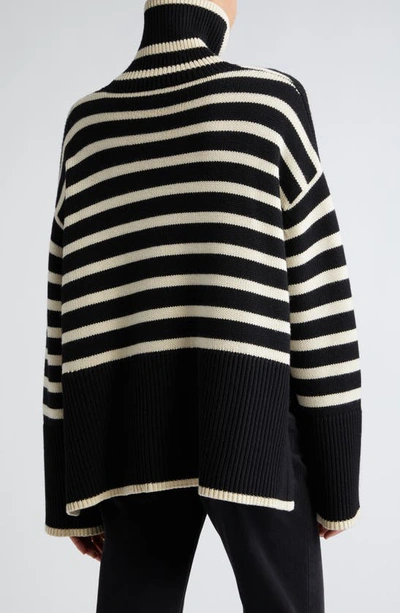 Shop Totême Toteme Stripe Wool Blend Turtleneck Sweater In Black Stripe