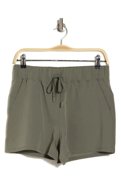 Shop 90 Degree By Reflex Citylite Expedition Travel Shorts In Mulled Basil
