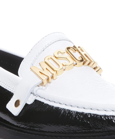Shop Moschino Flat Shoes In White