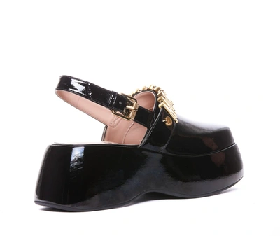 Shop Moschino Sandals In Black