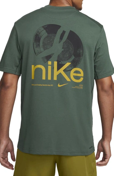 Shop Nike Dri-fit Studio '72 Graphic T-shirt In Vintage Green/ Sundial