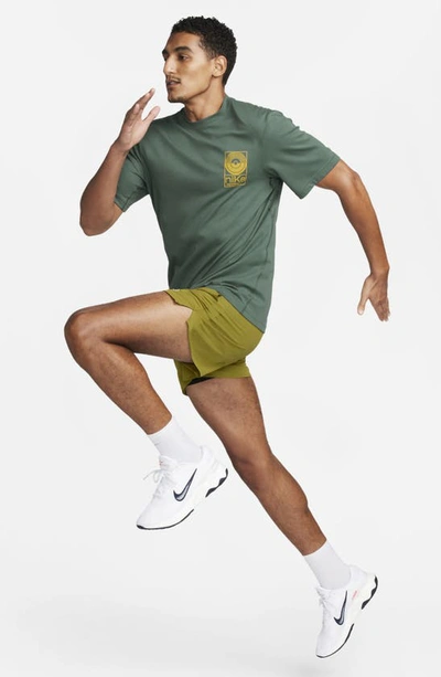 Shop Nike Dri-fit Studio '72 Graphic T-shirt In Vintage Green/ Sundial