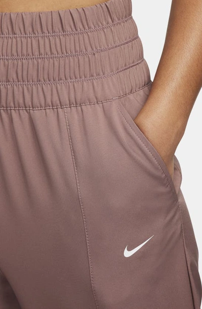 Shop Nike Dri-fit One Track Pants In Smokey Mauve/ White