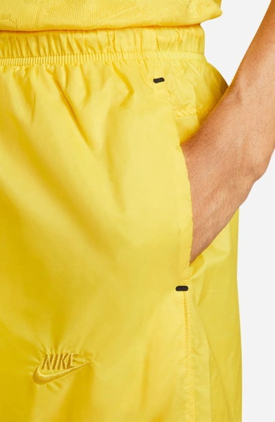 Shop Nike Sportswear Tech Pack Woven Shorts In Tour Yellow/ Black/ Sulfur