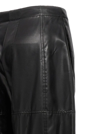 Shop Jil Sander Coated Pants In Black