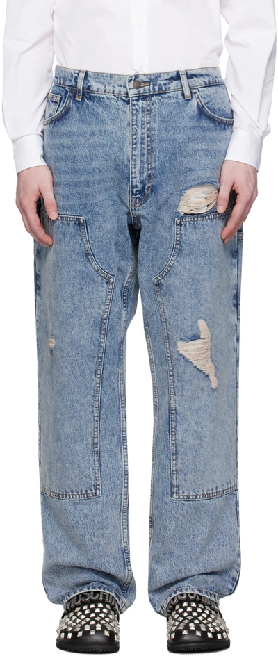 Shop Moschino Blue Bleached Jeans In A0282