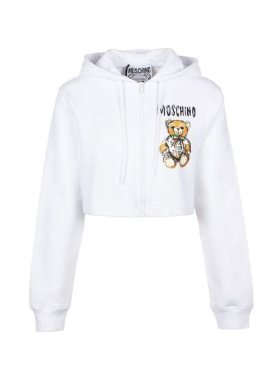 Shop Moschino Logo Printed Cropped Hoodie In White