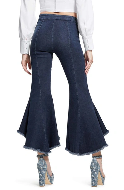 Shop Guess Sofia 1981 Frayed Ankle Flare Jeans In Blue