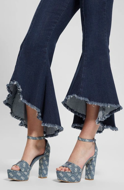 Shop Guess Sofia 1981 Frayed Ankle Flare Jeans In Blue