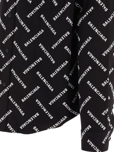 Shop Balenciaga Allover Logo Printed Long-sleeved Shirt In Black