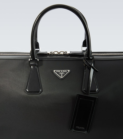 Shop Prada Leather-trimmed Duffel Bag