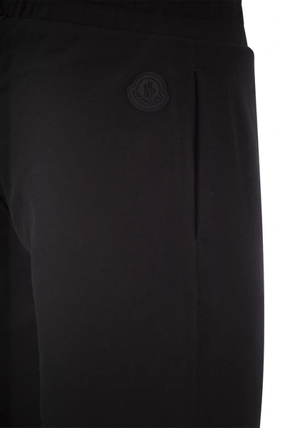 Shop Moncler Logo-embossed Sports Trousers In Black