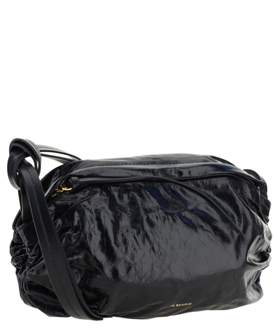 Shop Jil Sander Cushion Crossbody Bag In Black