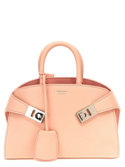 Shop Ferragamo 'hug Mini' Handbag In Pink