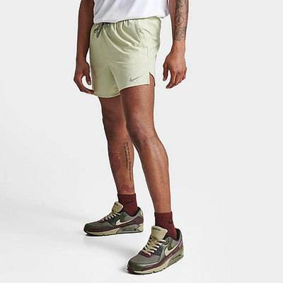 Shop Nike Men's Dri-fit Stride 5" Brief-lined Running Shorts In Olive Aura/dark Stucco