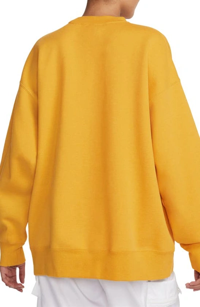 Shop Jordan Flight Fleece Oversize Crewneck Sweatshirt In Yellow Ochre/ Heather