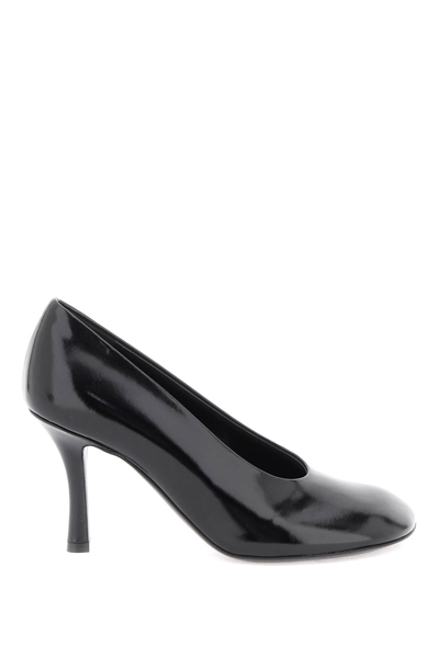 Shop Burberry Glossy Leather Baby Pumps In Black