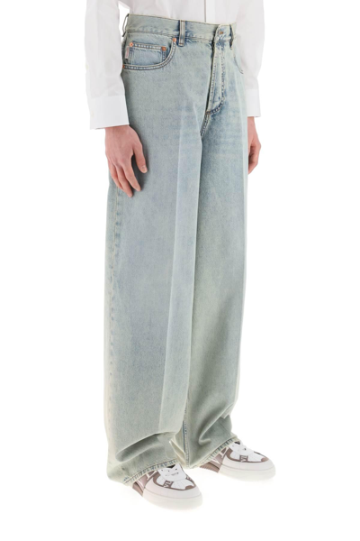 Shop Valentino Oversized Jeans With V Detail In Blue