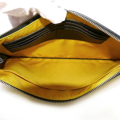Shop Gucci Gg Nylon Yellow Canvas Clutch Bag ()