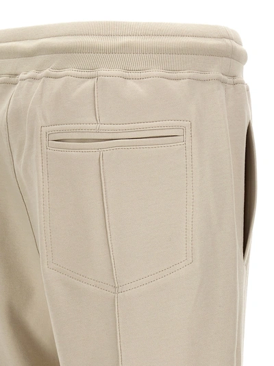 Shop Brunello Cucinelli Central Stitching Joggers Pants Beige