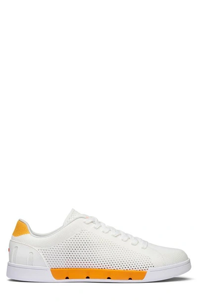 Shop Swims Breeze Tennis Washable Knit Sneaker In White/ Saffron