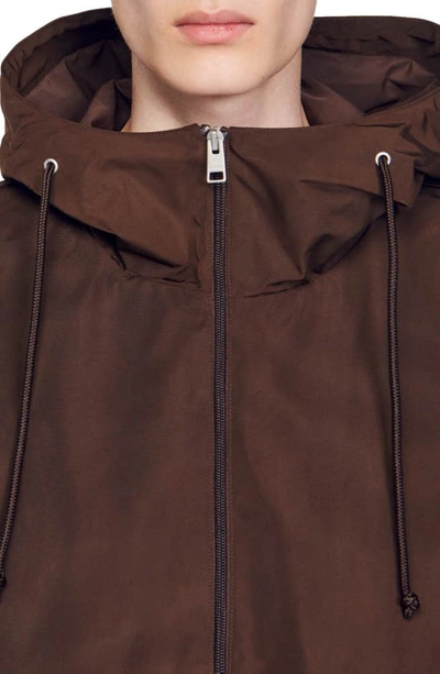 Shop Sandro Windy Hooded Windbreaker Jacket In Black Brown