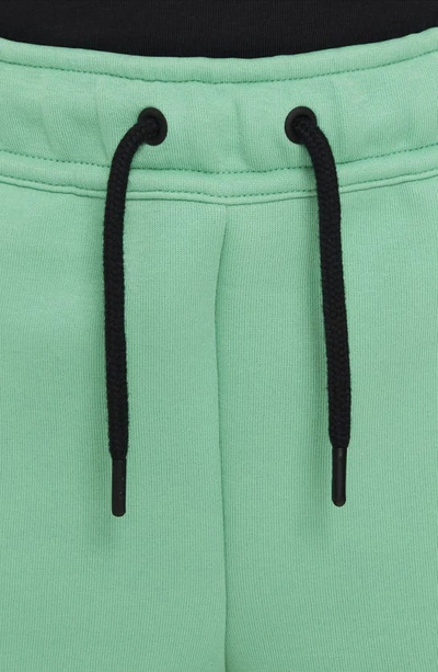 Shop Nike Sportswear Tech Fleece Shorts In Spring Green/ Black/ Black