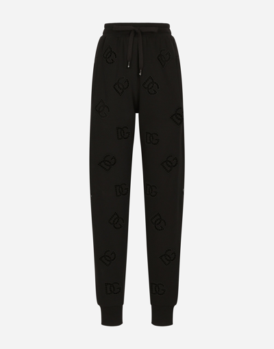 Shop Dolce & Gabbana Jersey Jogging Pants With Cut-out And Dg Logo In Black