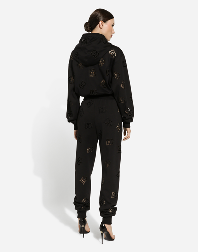Shop Dolce & Gabbana Jersey Jogging Pants With Cut-out And Dg Logo In Black