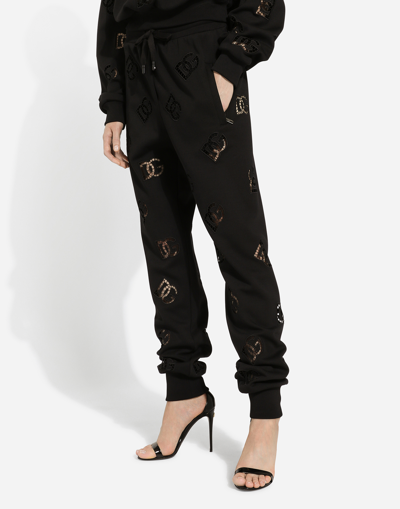 Shop Dolce & Gabbana Jersey Jogging Pants With Cut-out And Dg Logo In Black