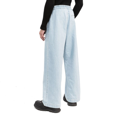 Shop Moncler Belted Denim Jeans