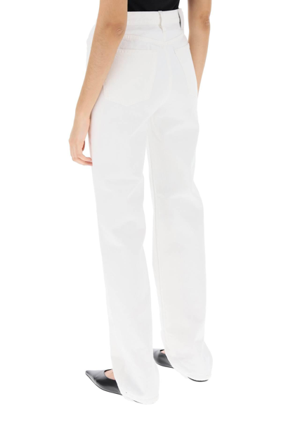 Shop Totême Straight Cut Loose Jeans In White