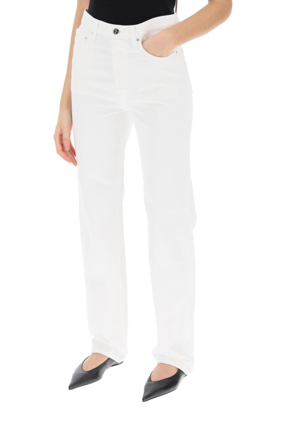 Shop Totême Straight Cut Loose Jeans In White